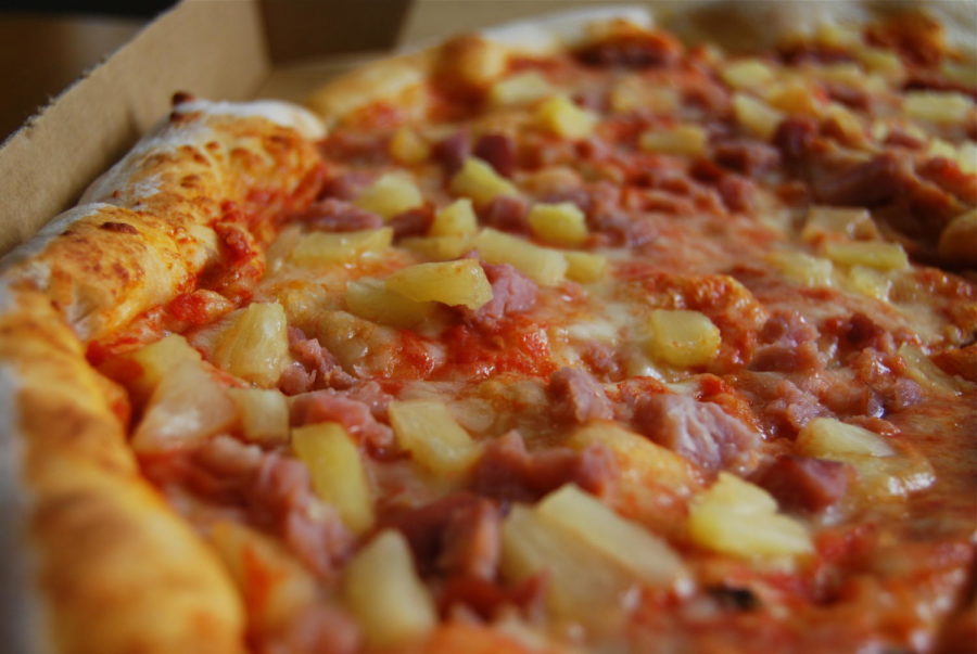A crispy pineapple pizza resting fresh out of the oven!