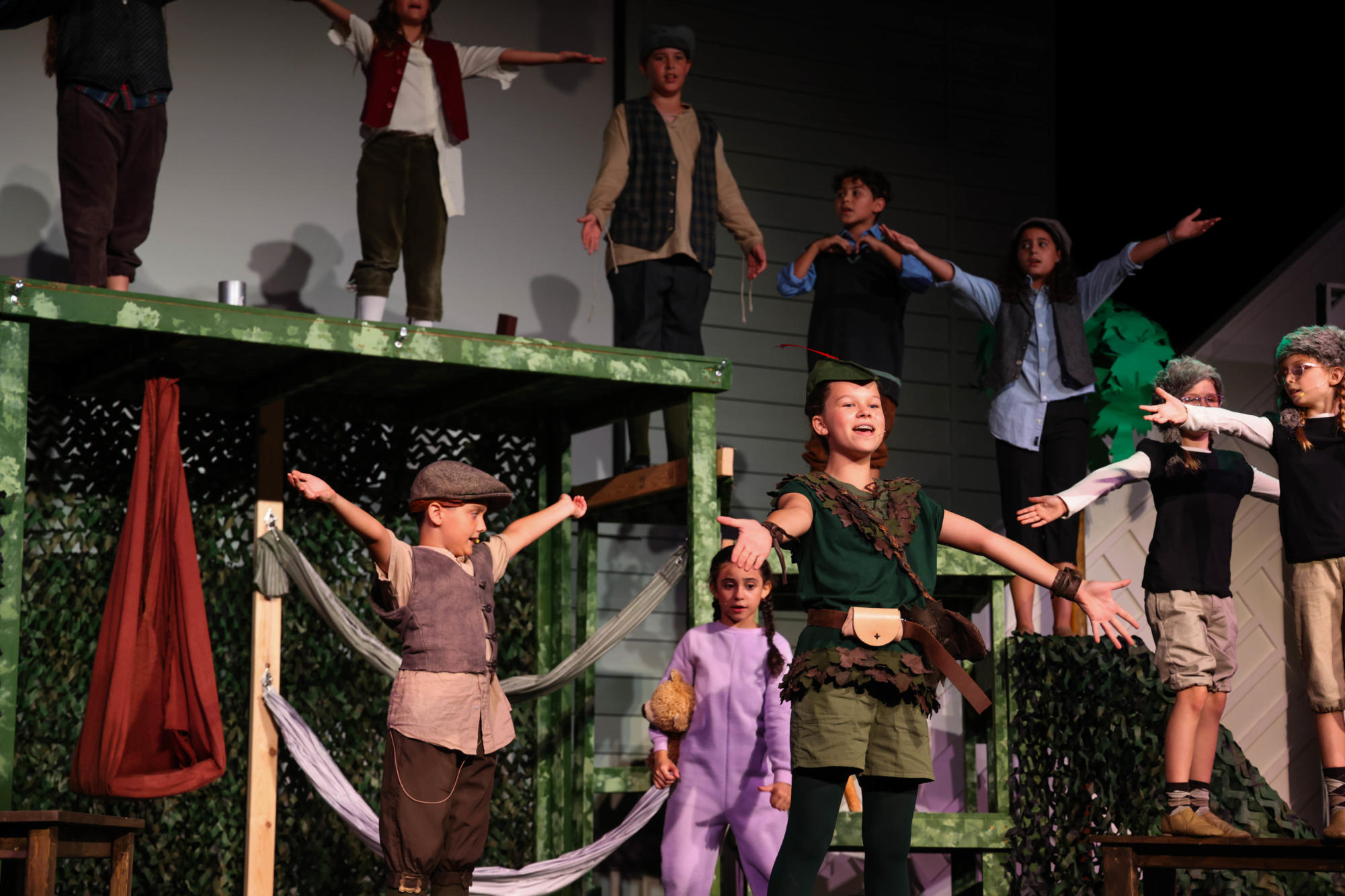 2023 Peter Pan production with a song by Peter Pan, played by Cadence Payne, and the lost boys, played by elementary and middle school children. 