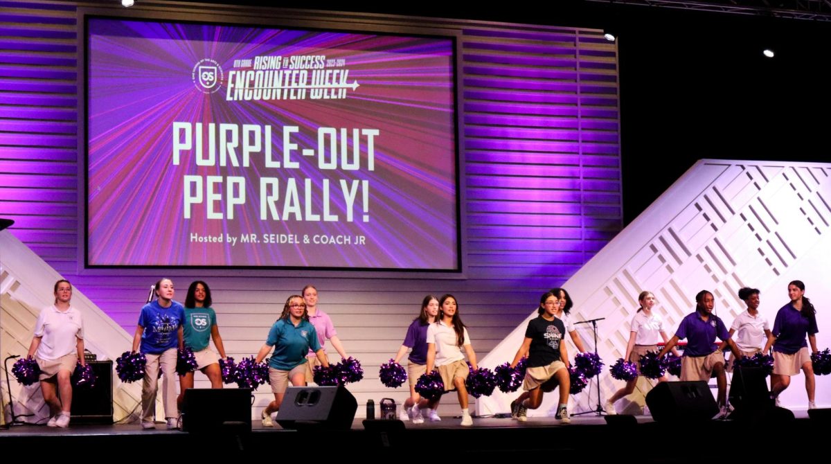 During the Purple Out Pep Rally, the cheer team pumped up the audience. 