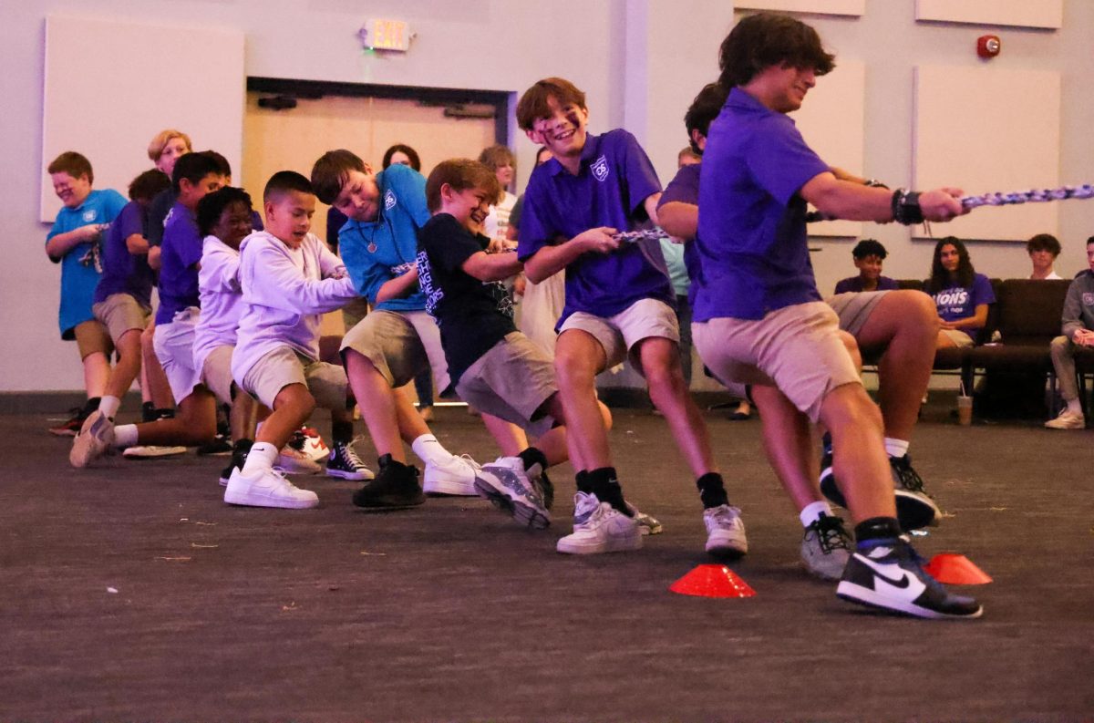 When the middle schoolers faced the high schoolers in tug-of-war, they continued adding members to the middle school side to finally beat the high schoolers. It took twice as many middle schoolers to finally get the better of the 8 high schoolers. 
