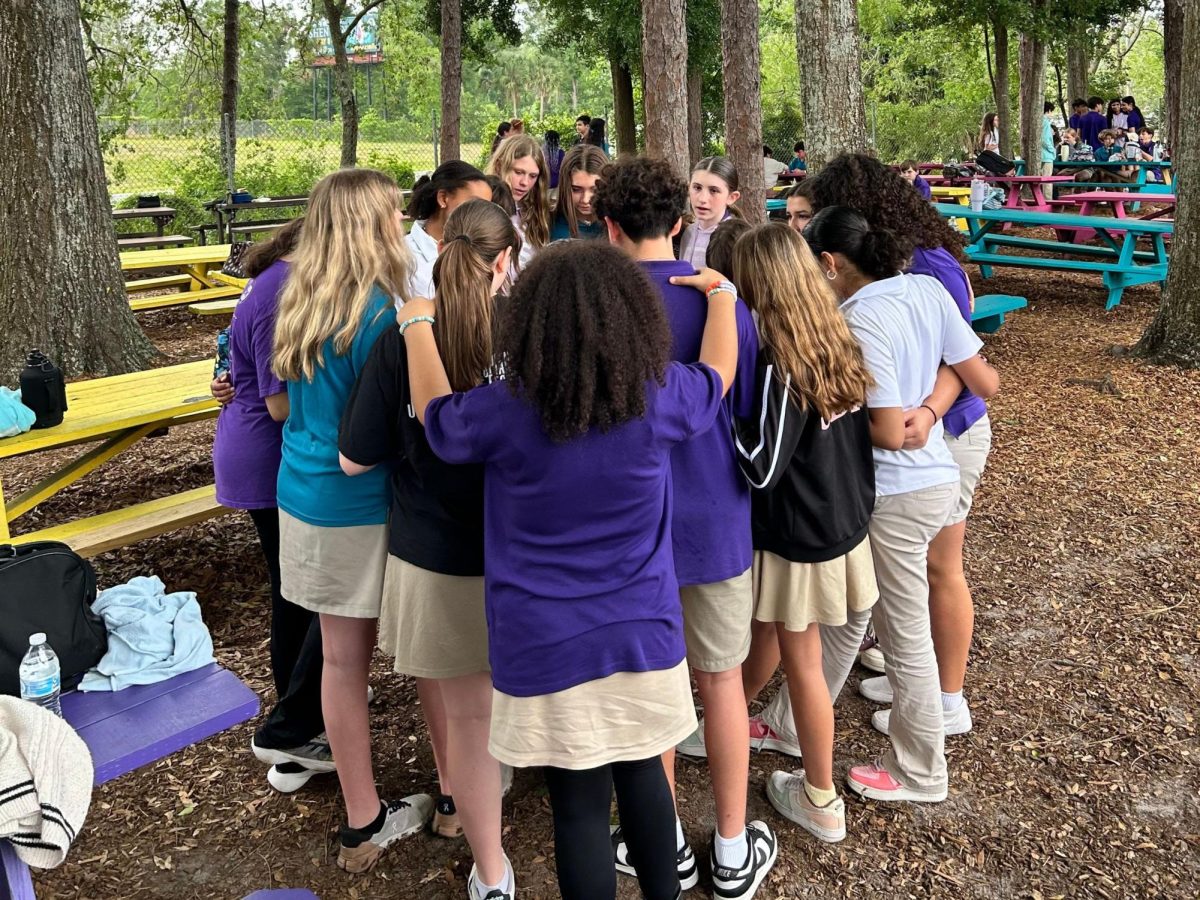 Aylie Owens, seventh grade, led some of her peers to pray over the dancers and their hardships. 