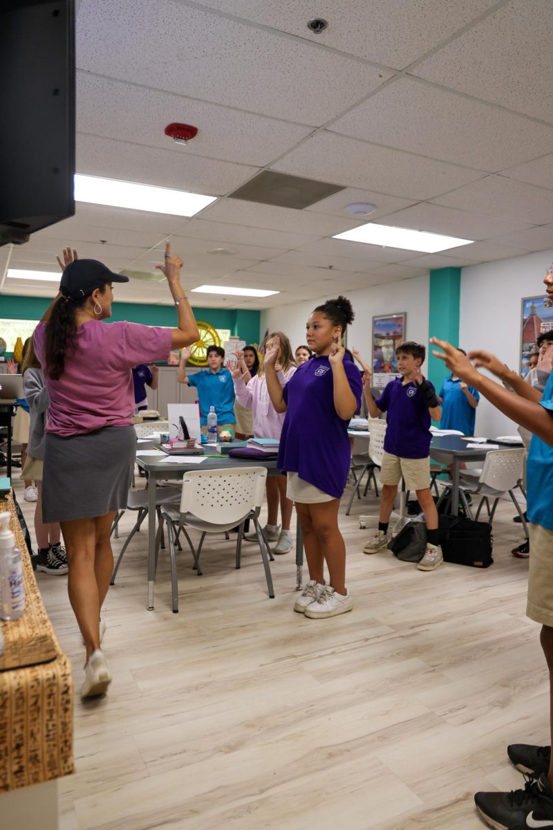 Learning with motions, Mrs. Schreiner's 6th grade Bible class learned about Martin Luther's Protestant Reformation. She taught them a hands on song to remember the facts of the event. 