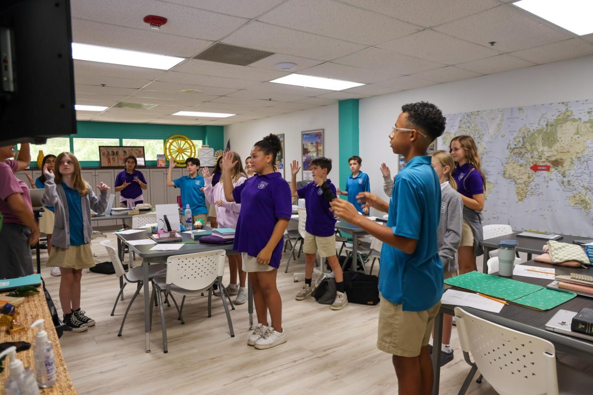 Learning with motions, Mrs. Schreiner's 6th grade Bible class learned about Martin Luther's Protestant Reformation. She taught them a hands on song to remember the facts of the event. 