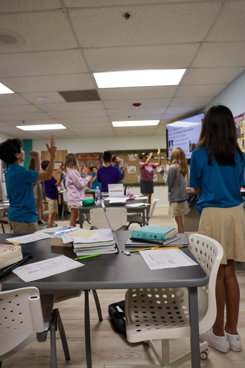 Learning with motions, Mrs. Schreiner's 6th grade Bible class learned about Martin Luther's Protestant Reformation. She taught them a hands on song to remember the facts of the event. 