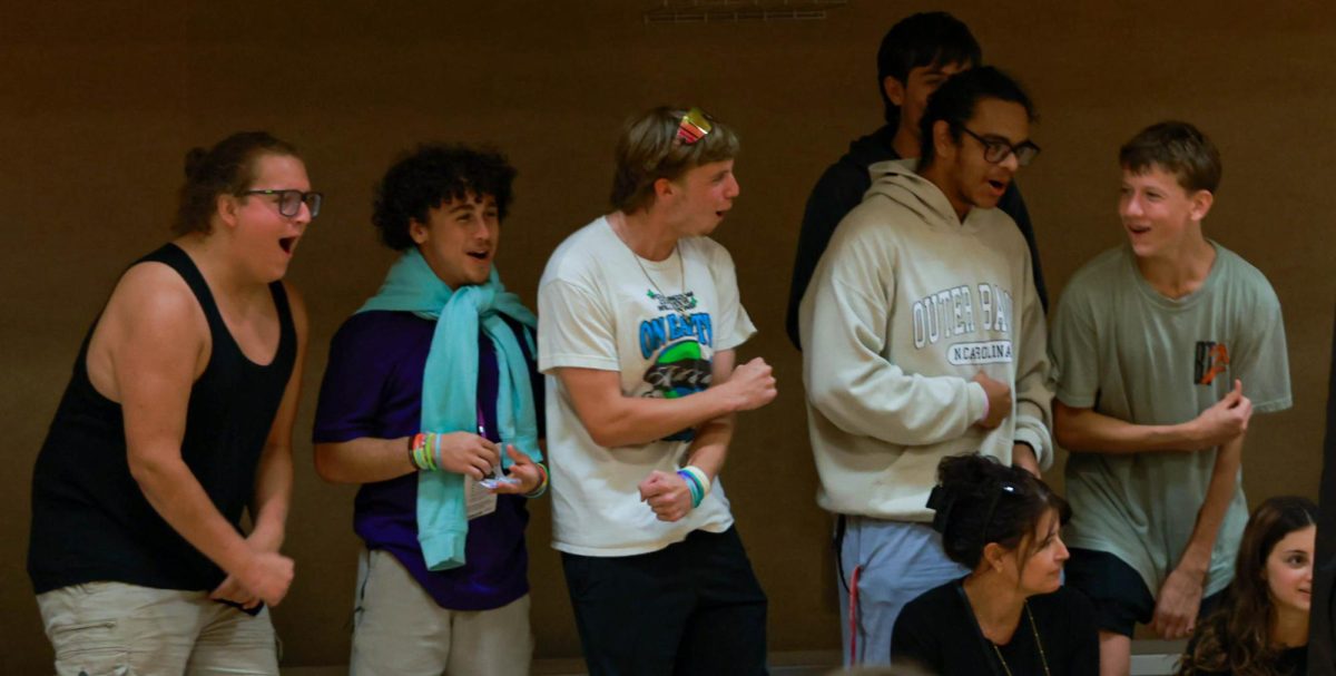 The OS boys football team and a friend formed a Boom squad to cheer on the girls. 