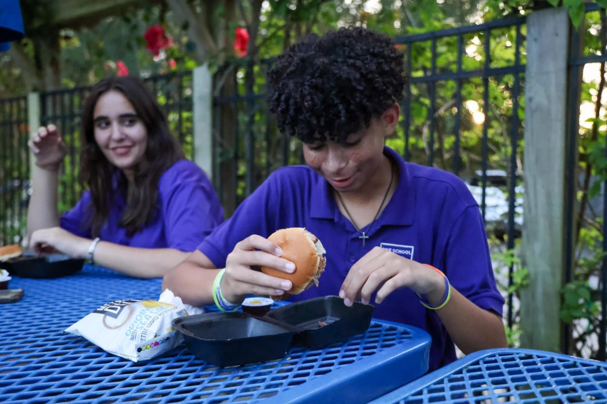 Avery Stepan and Marcus Munroe enjoy their barbeque given out from Papa Diesel's at the event. 