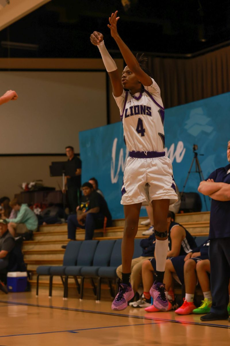 Preston Richmond, 10th grade, shooting a 3 point shot.