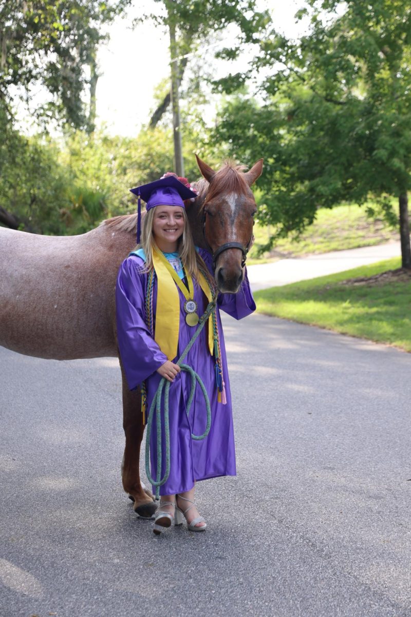 Jillian Wilson, 12th grade, brought her horse, Autumn, to school for a photoshoot.