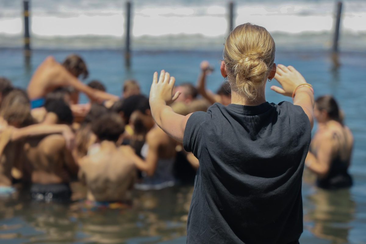 Before the baptisms took place, the team prayed over each other. Ava Crozier, 12th grade prayed over the entire team from the shore. 