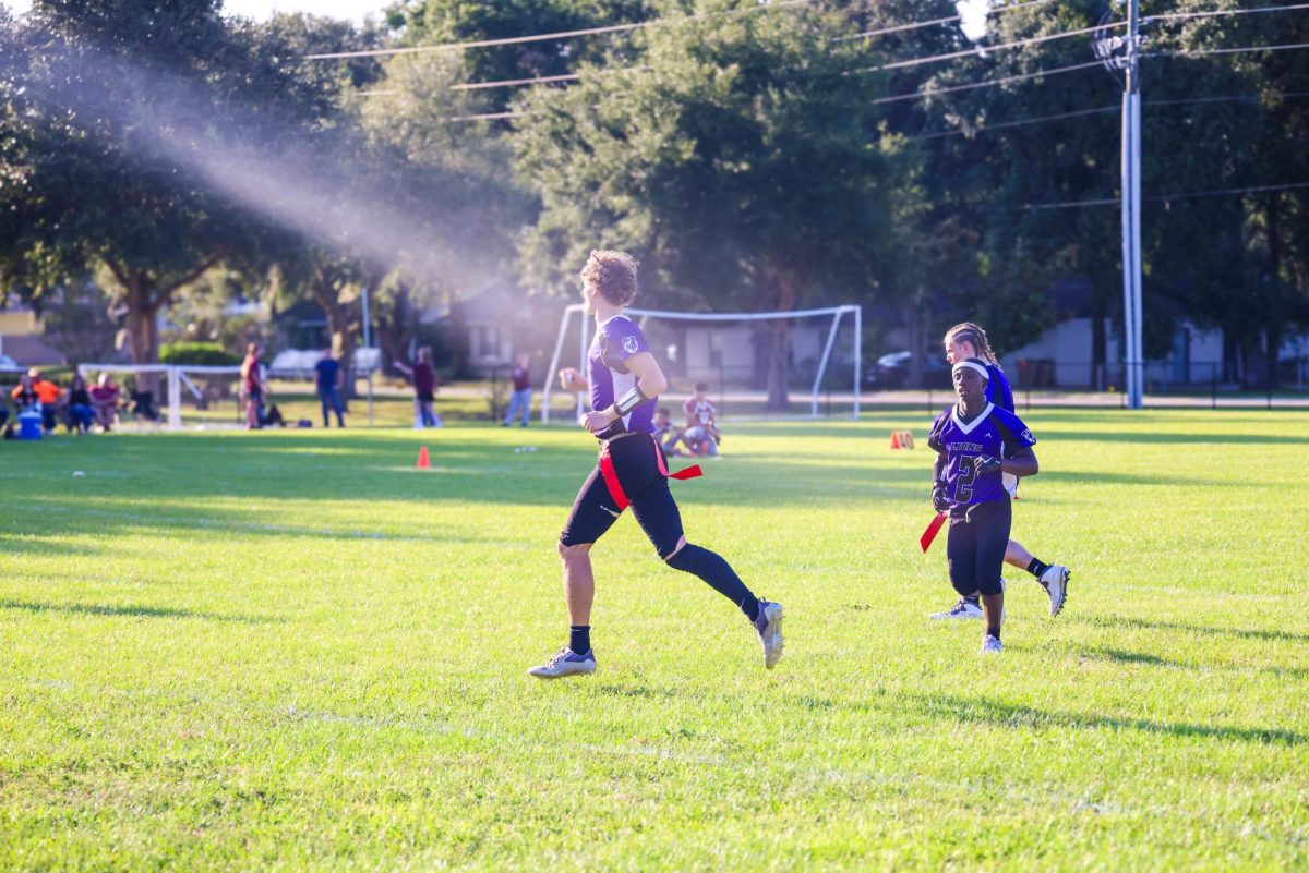 Jeremiah Schilling, Ethan Predergast, and Brandon Greaver, jogging on the Field