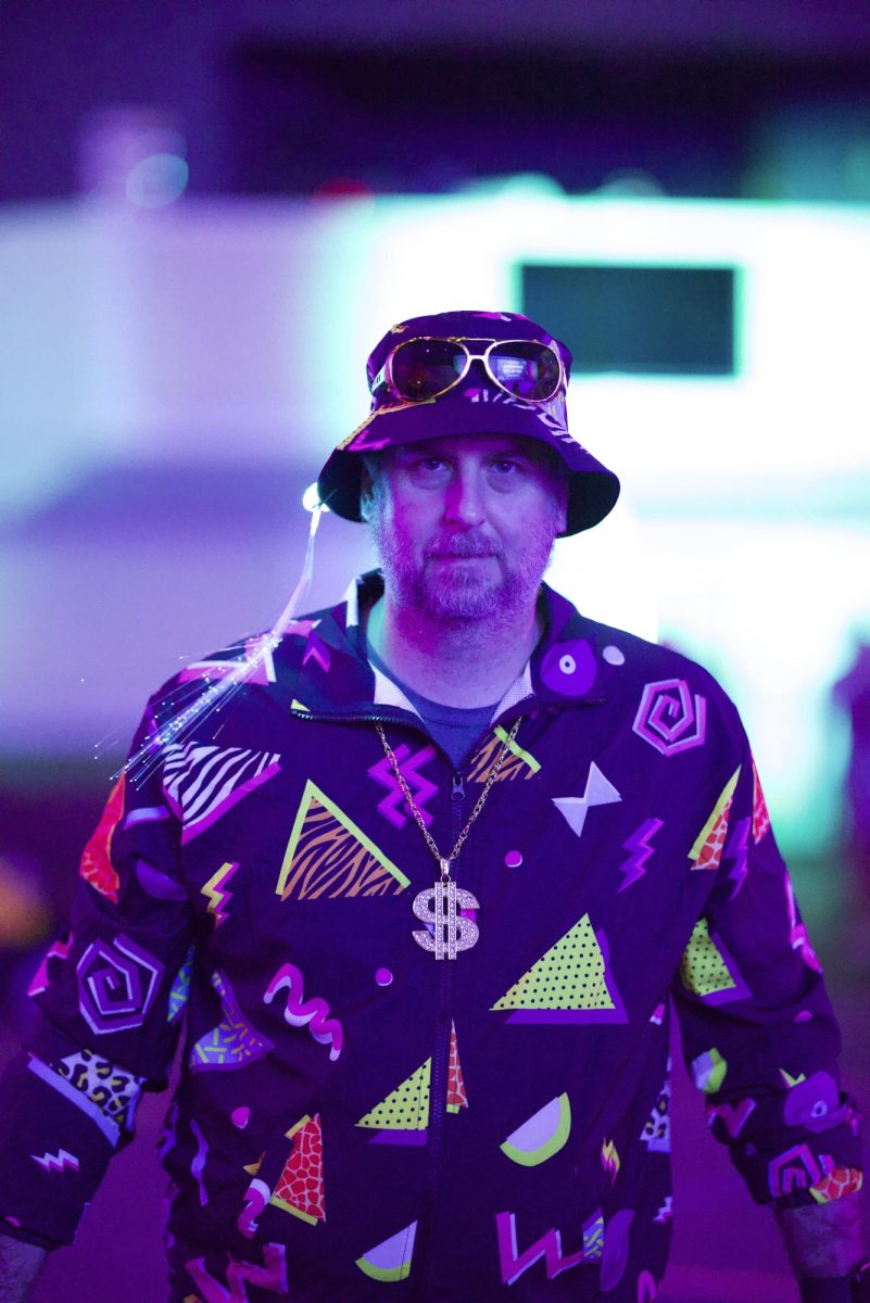 Mr. Moore represents the House of Grit during the Character House '80s Glow-in-the-Dark Dodgeball Tournament. Teachers and scholars eagerly competed against other character houses in hopes of earning points for their house. “My costume was inspired by my life. I AM the 80’s!” said Jay Moore, staff.