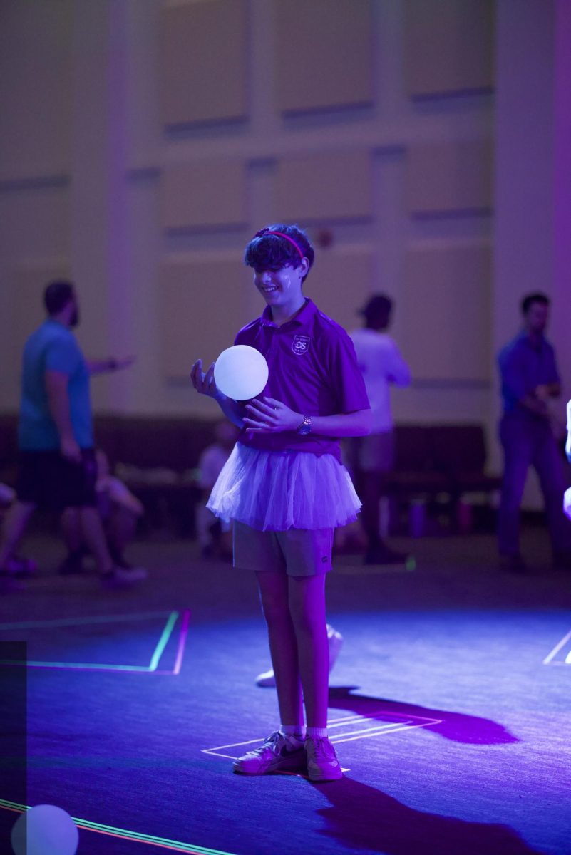 Representing the house of Self Control, Jonah Drake participates in the Character House '80s Glow-in-the-Dark Dodgeball Tournament. Drake rocked neon facepaint, a neon headband, and a tutu, bringing school spirit to the court while preparing to win.
