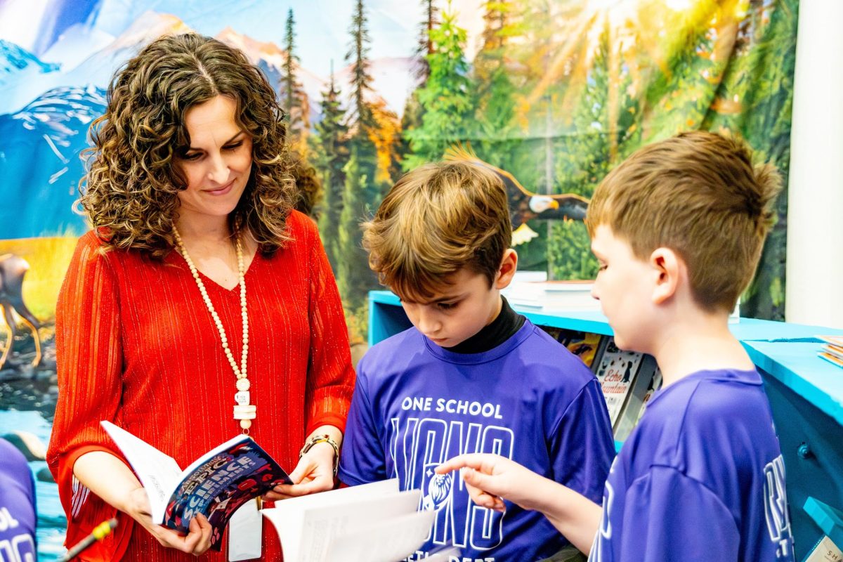 Ms. Cress suggests some books for her scholars at the book fair.