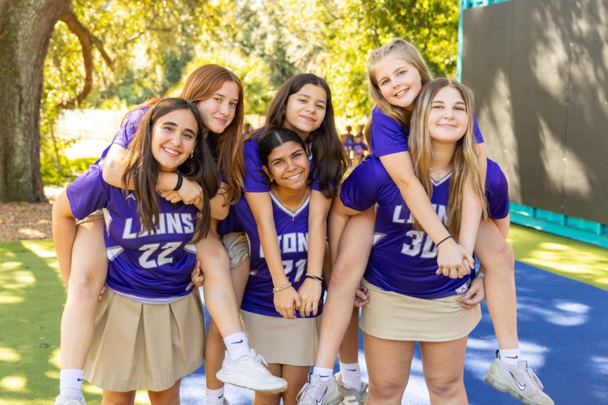 The volleyball team celebrates at the pep rally before heading off to the State's Competition for the first time in OS history. 
