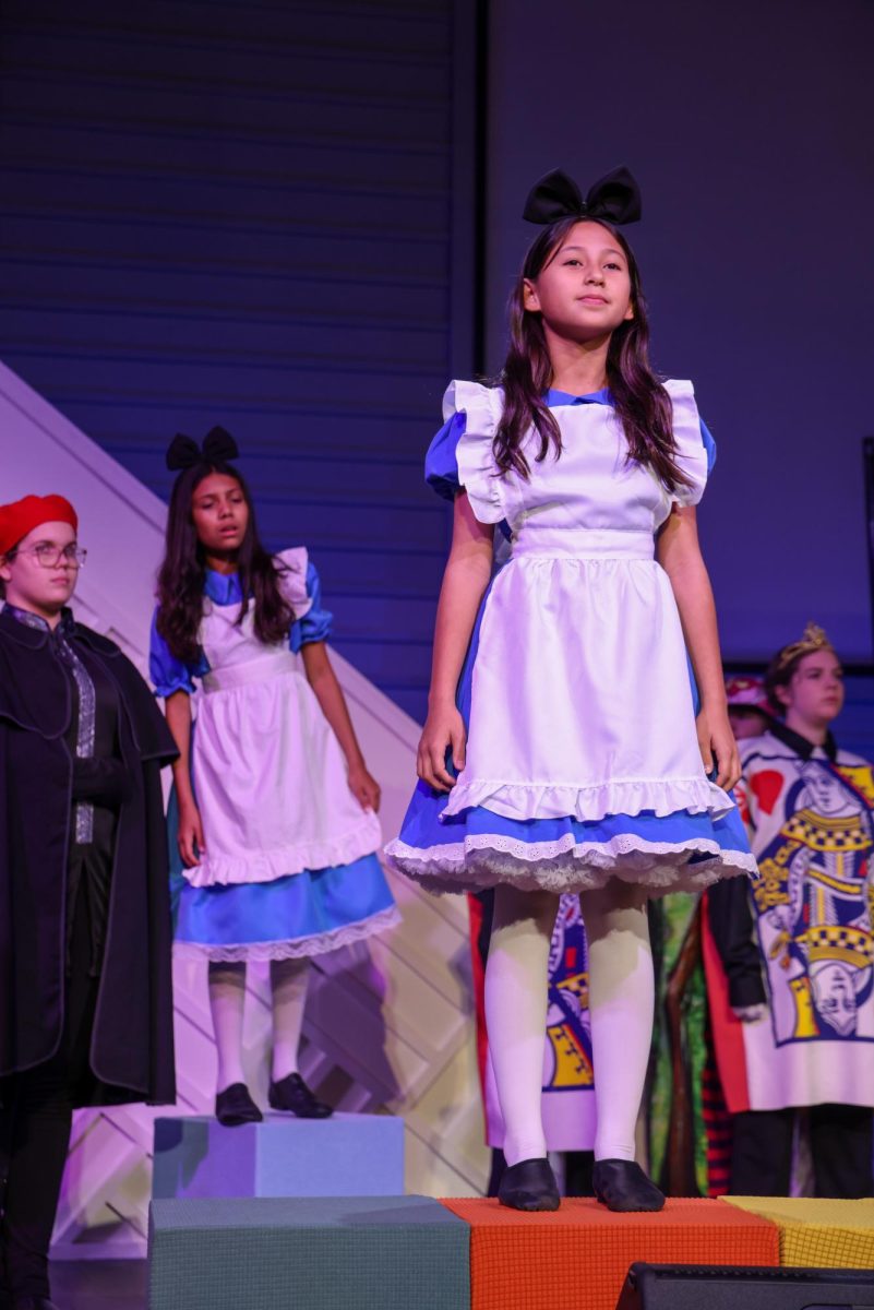 Mica Miller performs as Alice during the Junior Thespians’ one-act play, Alice in Wonderland. She brings the character to life with her strong acting and bright personality on stage.