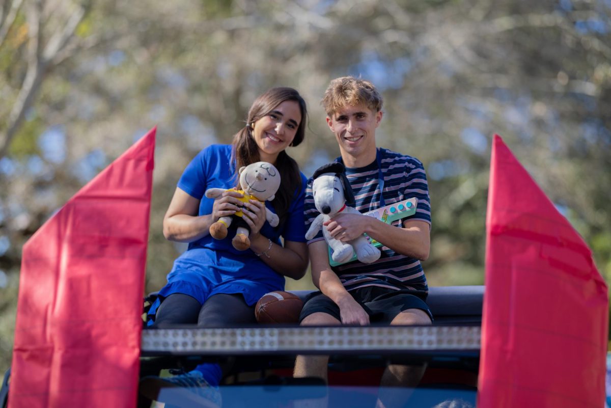 Avery Stepan and Wyatt Bonos in the homecoming parade with their snoopy themed float. 