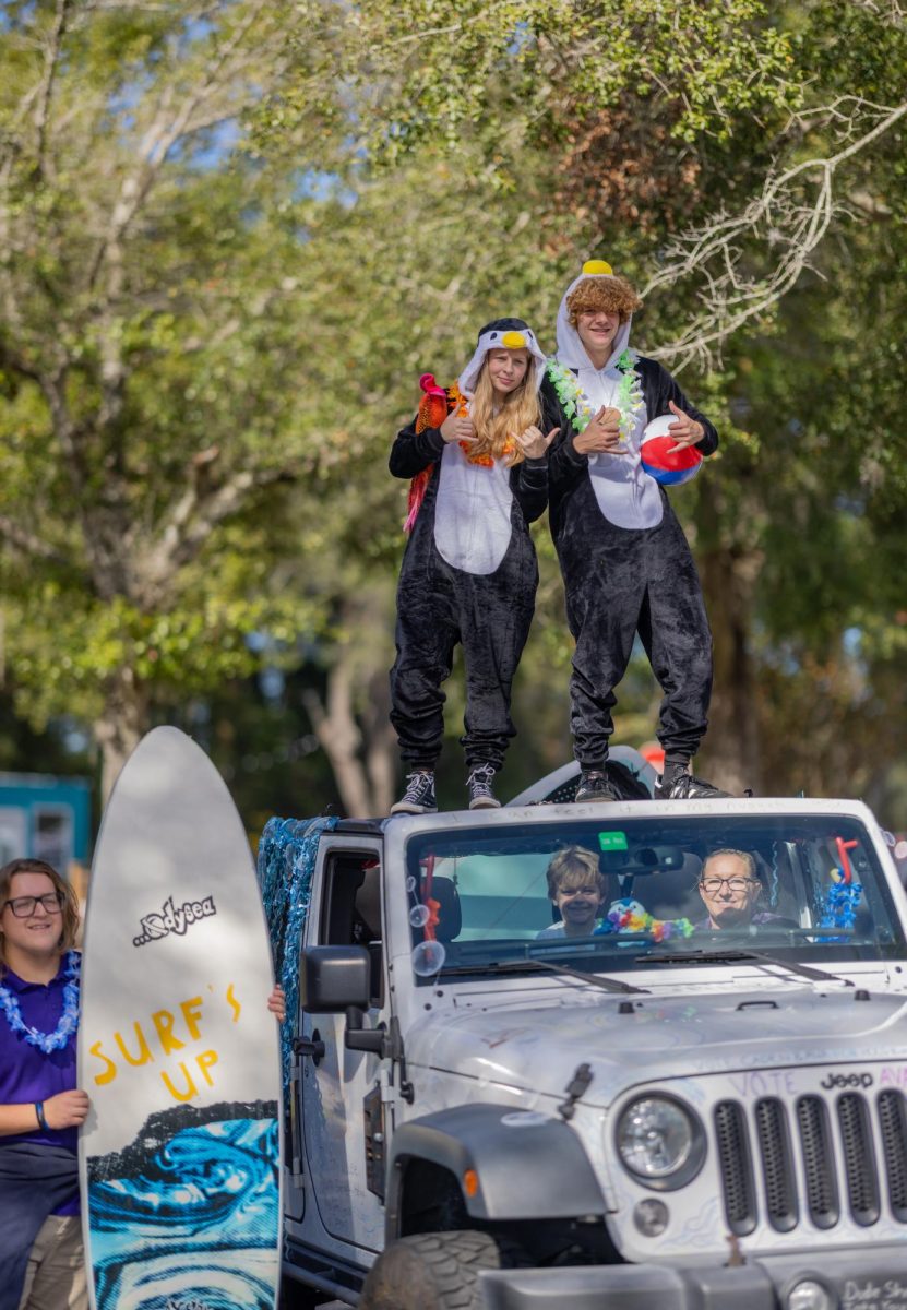 Ava Crozier and Caden Tucker in their beach themed float for the homecoming float. 